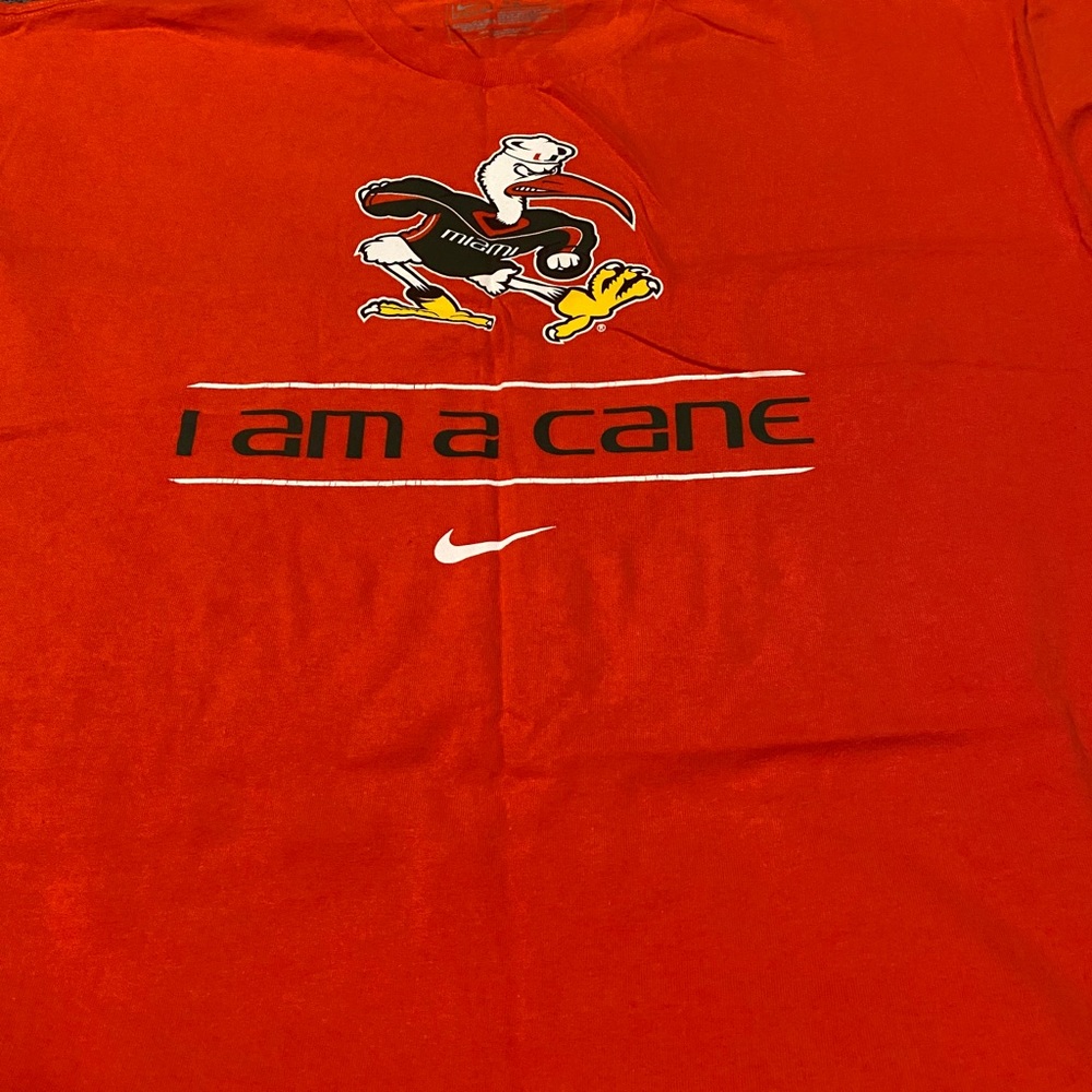 NWOT ORANGE U NIKE TEE SHIRT